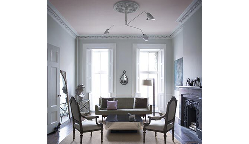 A classic gray living room with powder pink ceiling and floor to ceiling windows. A classic gray living room with powder pink ceiling and floor to ceiling windows.