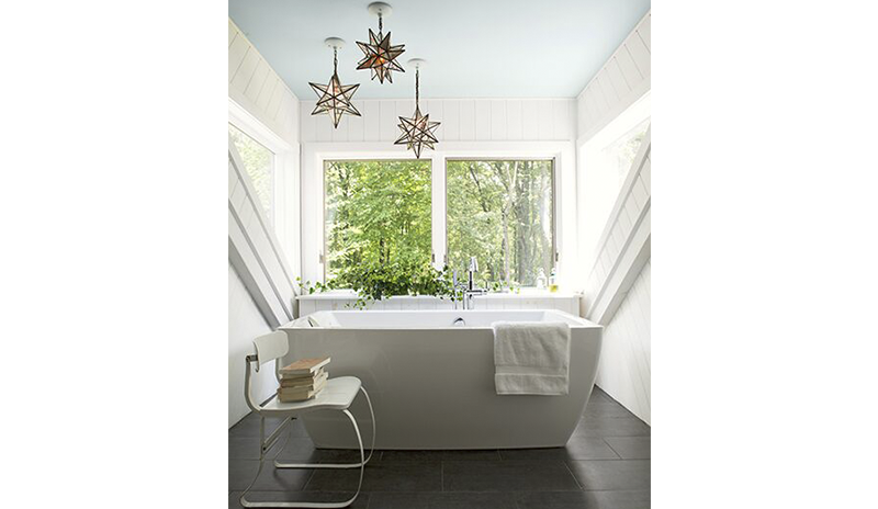 Bathroom with a soft blue ceiling and white modern bathtub. Bathroom with a soft blue ceiling and white modern bathtub.