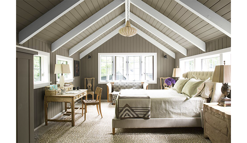 Rich craftsmen bedroom with an angled gray and white ceiling. Rich craftsmen bedroom with an angled gray and white ceiling.