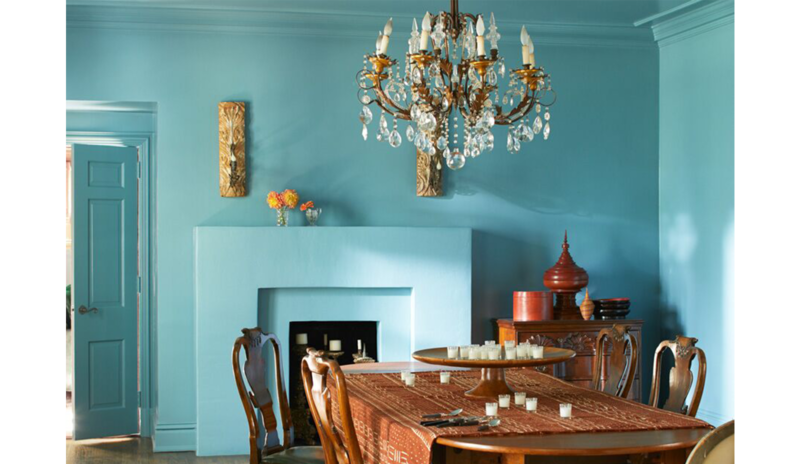 Blue-painted opulent dining room with exotic classic style, chandelier, large wooden table and chair Blue-painted opulent dining room with exotic classic style, chandelier, large wooden table and chair