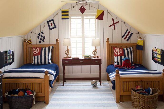 Top floor nautically themed kids room with yellow angled ceiling and matching bed room set. Top floor nautically themed kids room with yellow angled ceiling and matching bed room set.