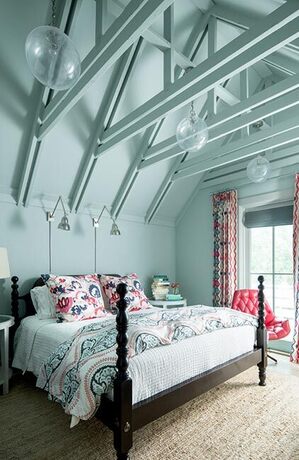 Soft blue bedroom with exposed geometric ceiling rafters. Soft blue bedroom with exposed geometric ceiling rafters.