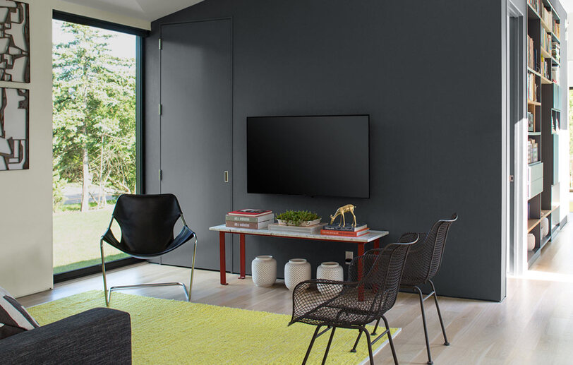 Contemporary living room with dark gray feature wall. Contemporary living room with dark gray feature wall.