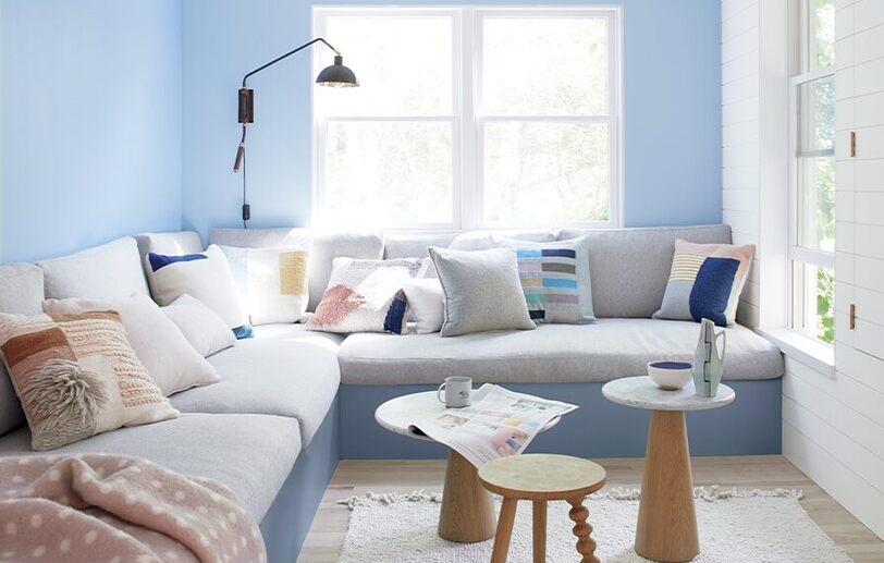 Blue & white living room with gray sectional & 3 end tables. Blue & white living room with gray sectional & 3 end tables.
